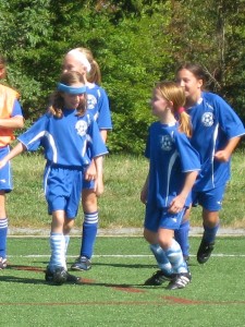 Jamie in headband, Emily facing on right